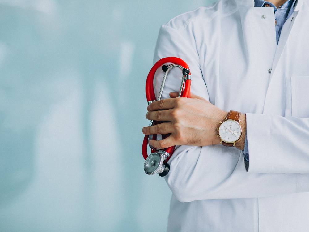 Doctor consulting patient at Enhance Health Choice